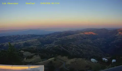 A scenic mountain landscape view under a twilight sky.