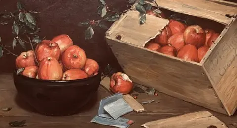A still life painting depicts a bowl of red apples and a wooden crate filled with apples.