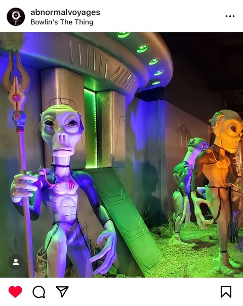 A photo showing alien sculptures inside an exhibit.