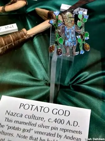 A close-up photo shows a small enameled figurine labeled as the potato god from the Nazca culture.
