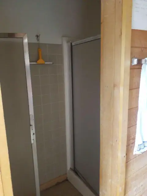 A view of a shower stall inside a bathroom.