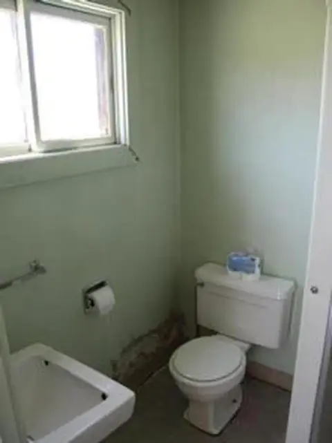 A small bathroom with a toilet and sink.