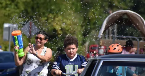 People participating in an outdoor activity amidst bubbles.