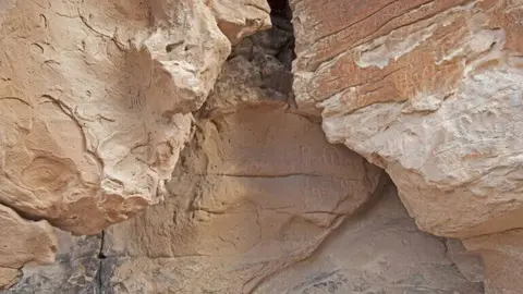 A close-up view of weathered rock formations and cliffs.