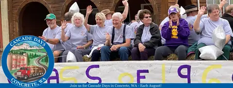 People wave from a float during a parade.