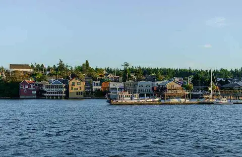 A view of a waterfront town across a body of water.