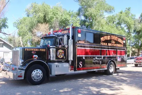 A fire department rescue truck parked outdoors.