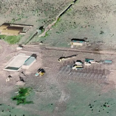 An aerial view of buildings and structures in a landscape.