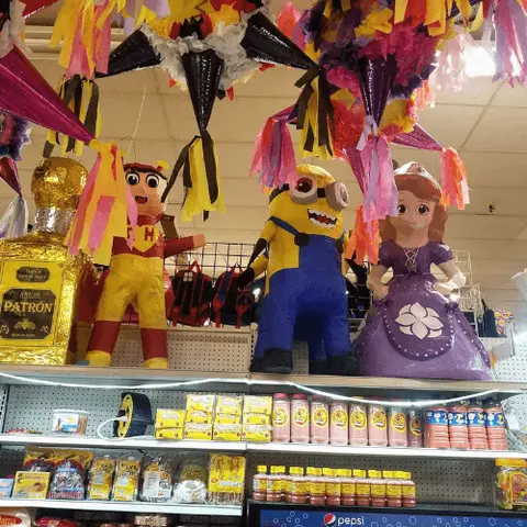 Various character piñatas and merchandise displayed on store shelves.
