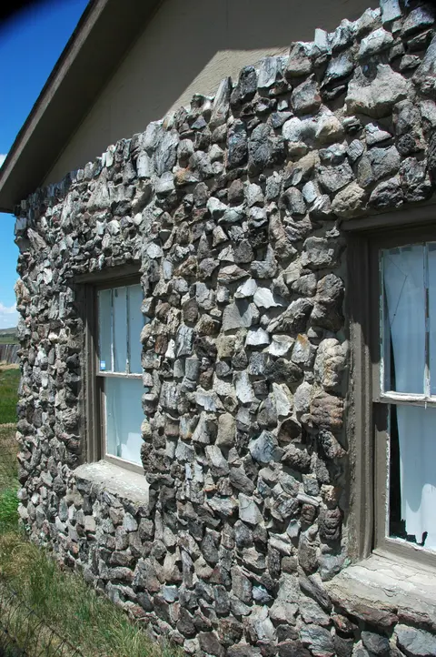 Dinosaur bone wall of Fossil Cabin.
