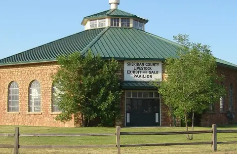 An exterior view of the Sheridan County Livestock Exhibit and Sale Pavilion building.