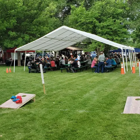 Cornhole and festival tent at Silt Heyday.