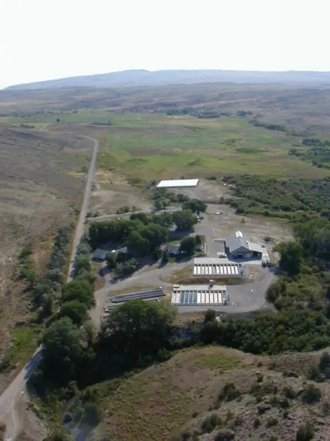 An aerial view of a facility and surrounding rural landscape.