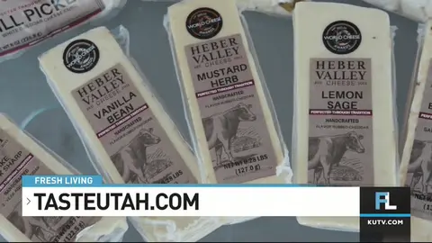 A close-up shot of several packages of flavored cheese.