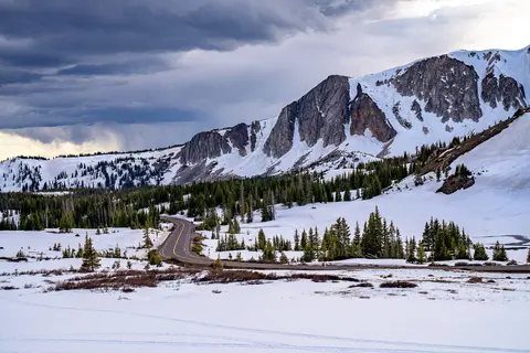 Snowy Range Scenic Byway below snowy peaks.