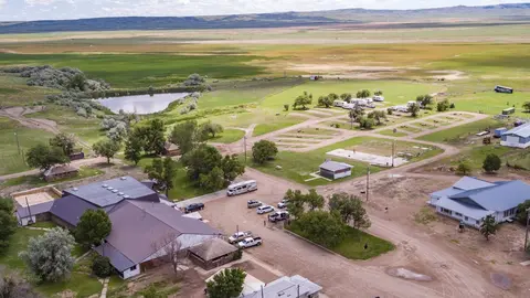 An aerial view of a rural campground and surrounding landscape.