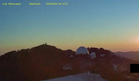 An outdoor view of an observatory at sunrise.