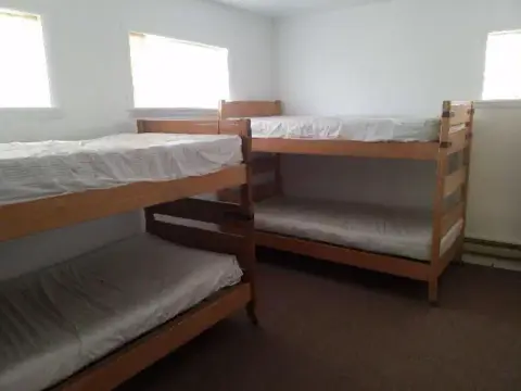 An interior view of a bedroom with bunk beds.