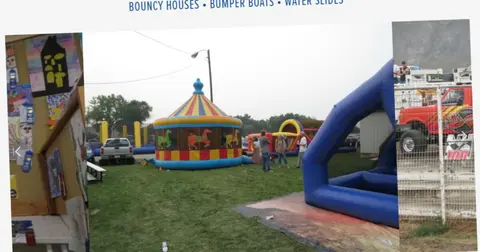 An outdoor inflatable bounce house area at an event.