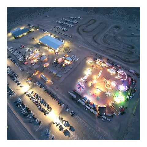 An aerial view of an illuminated carnival at night.