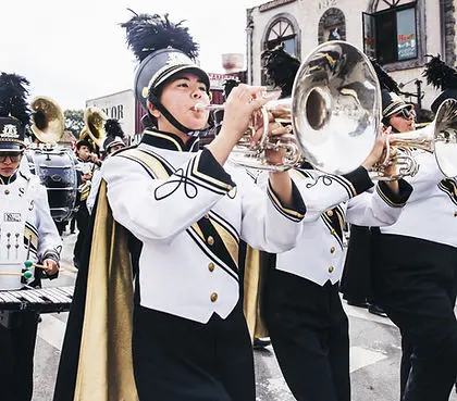 A marching band performing in a street parade.