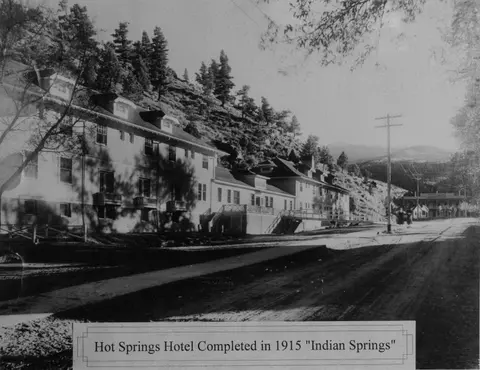Historic black and white photo of a hotel exterior with a caption at the bottom.