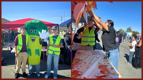 Two people pose with a vegetable mascot and another sets up a booth outdoors at an event.