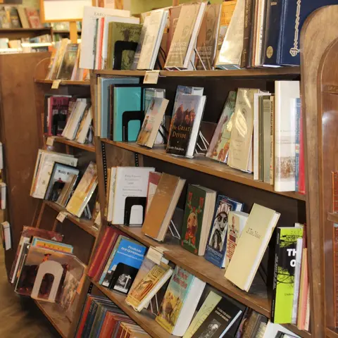 Bookshelves filled with various books inside a bookstore.