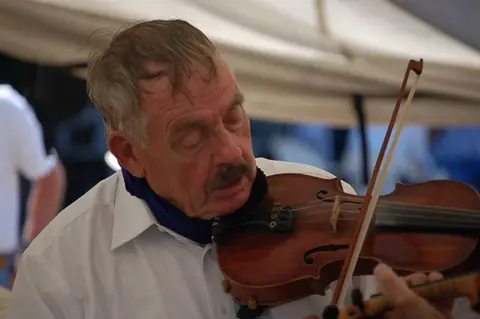 A man plays a violin.