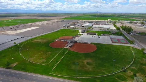An aerial view of a baseball complex and surrounding fields.