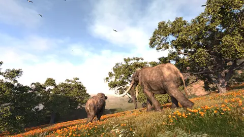 Two mammoths walk across a hillside covered in wildflowers and trees.