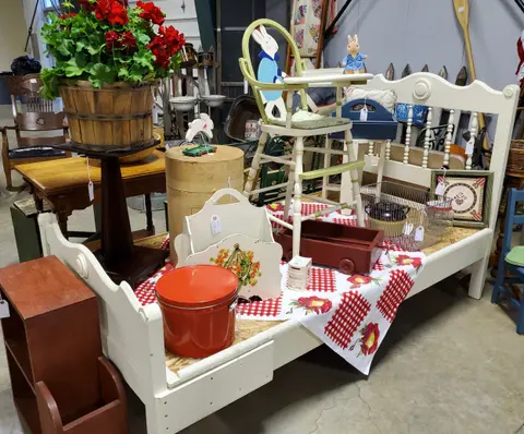 A display of antiques and crafts inside a shop or market.
